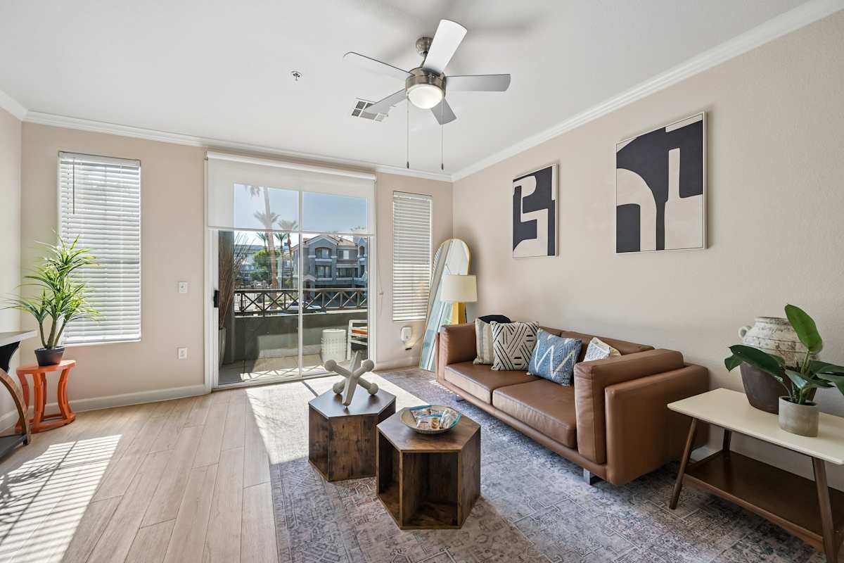 Furnished apartment living area shown — representative home at The Highland.