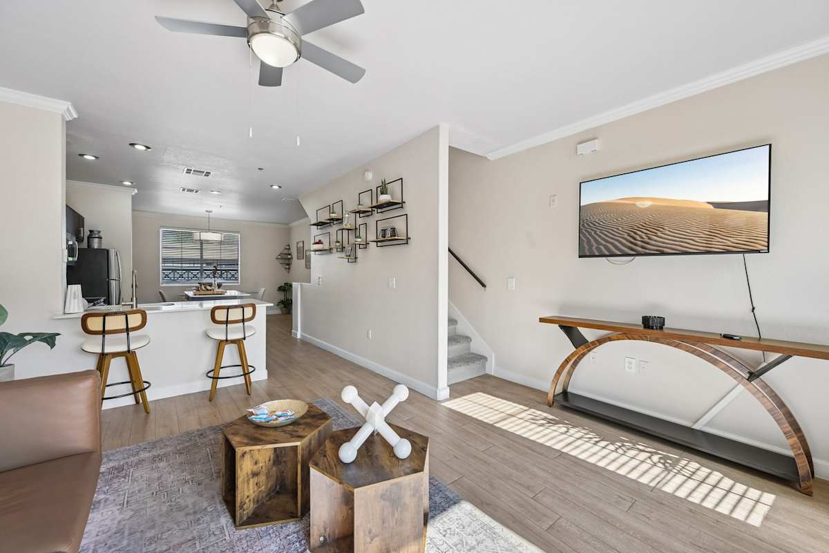 Furnished apartment living area shown — representative home at The Highland.