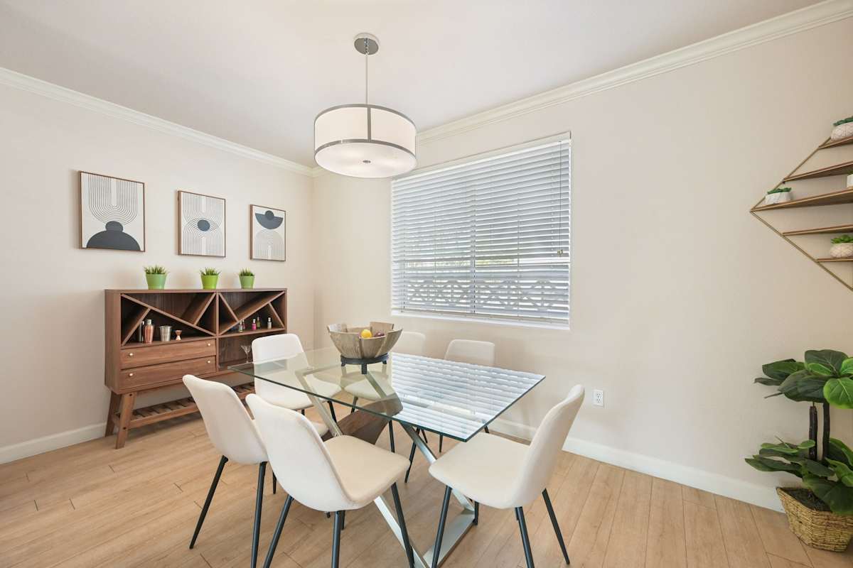 Furnished dining area shown — representative home at The Highland.
