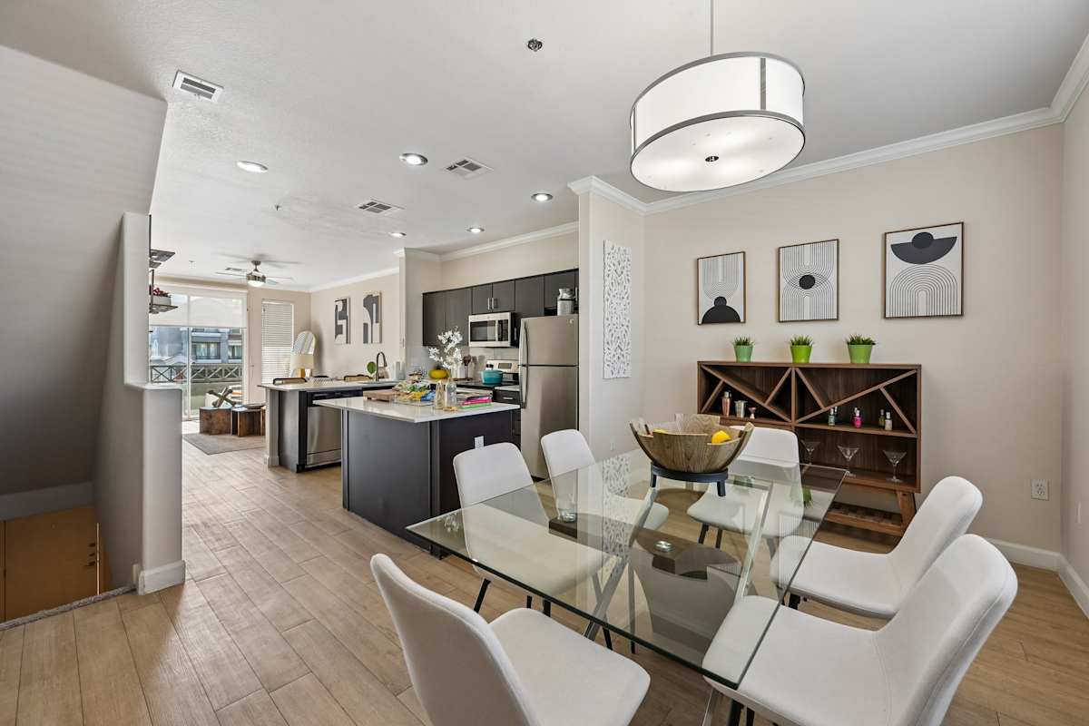 Furnished dining area shown — representative home at The Highland.