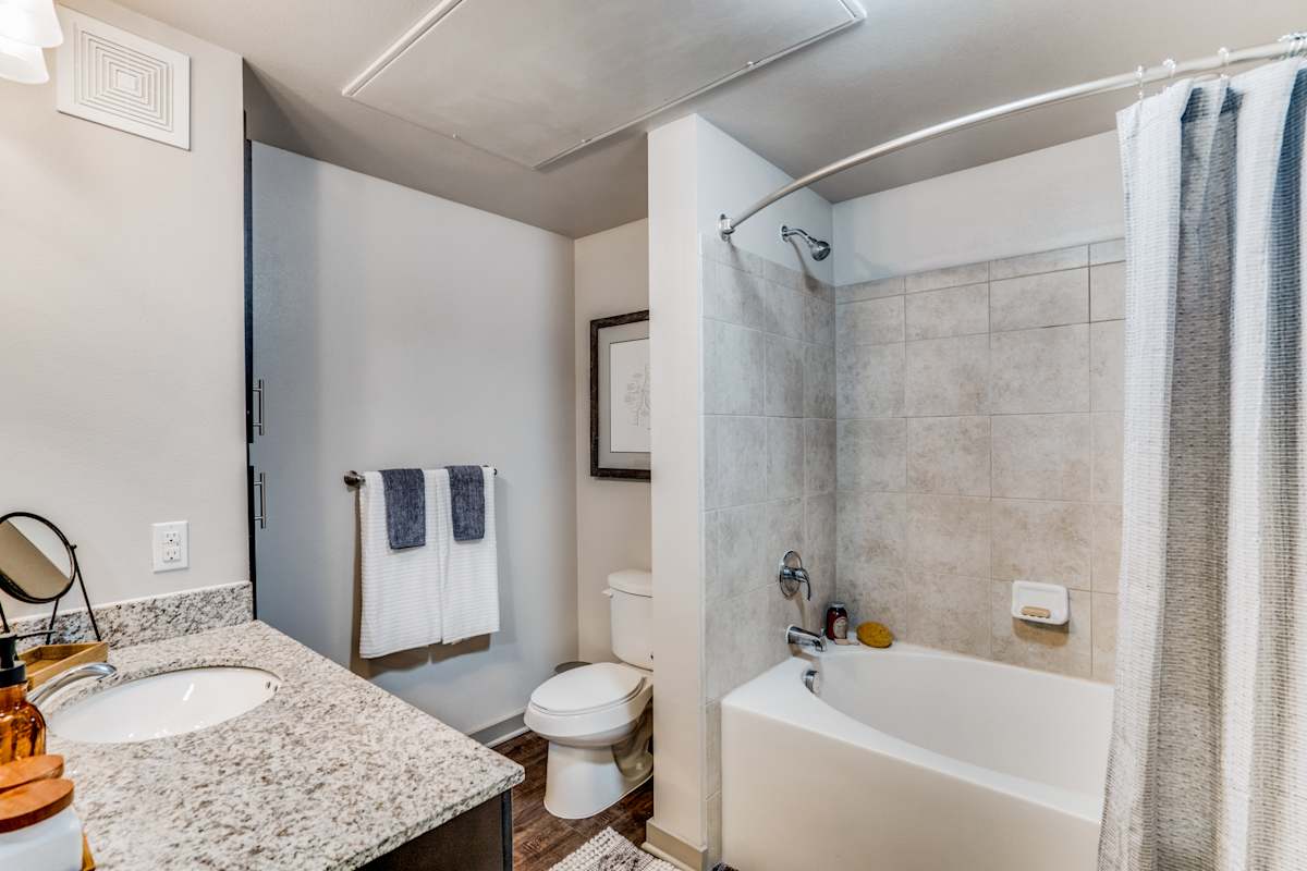 Junction 15 bathroom with garden tub and granite counters - Plano, TX