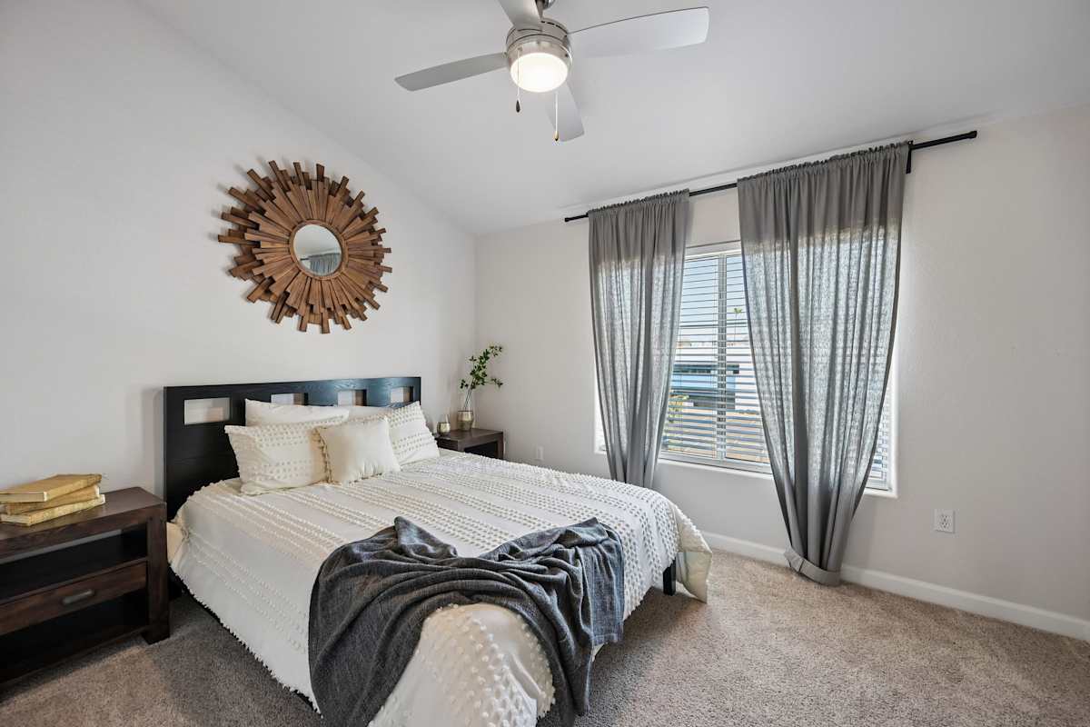 Furnished bedroom shown — representative home at The Highland.