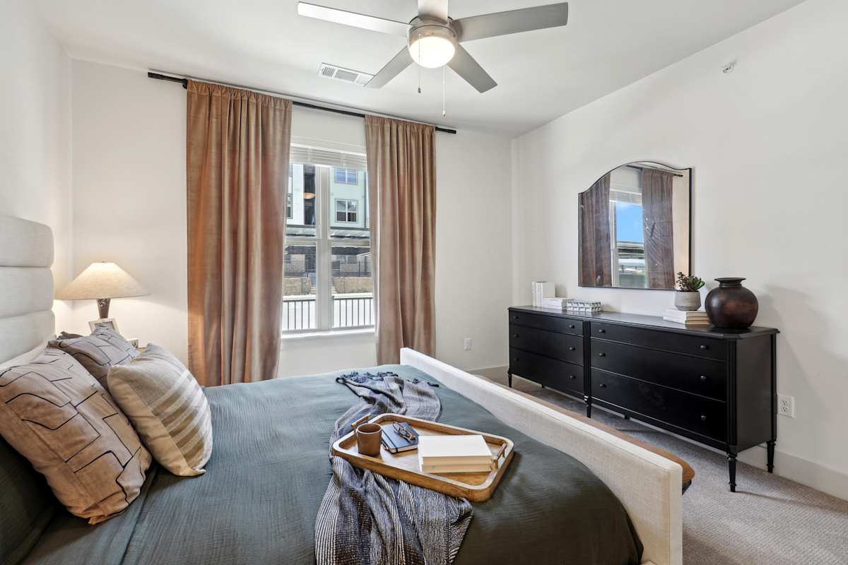 Trailhead at Chisholm Trail Ranch bedroom with ceiling fan - Fort Worth, TX