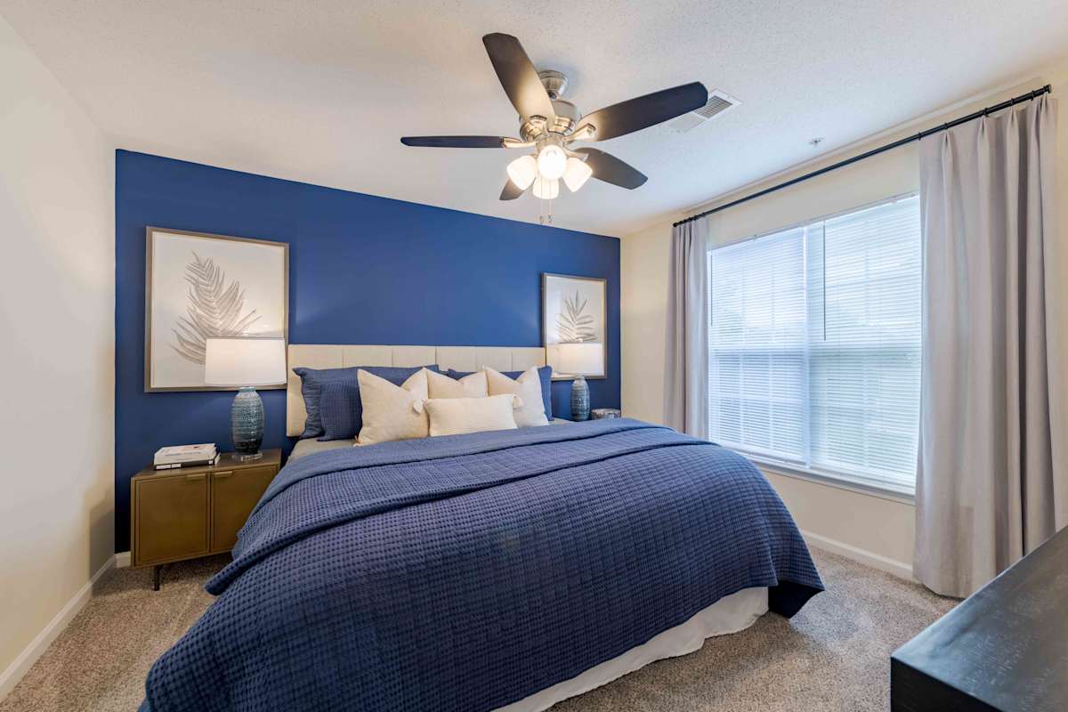 Reserve at Carrington Place apartment bedroom with ceiling fan - Fayetteville, NC