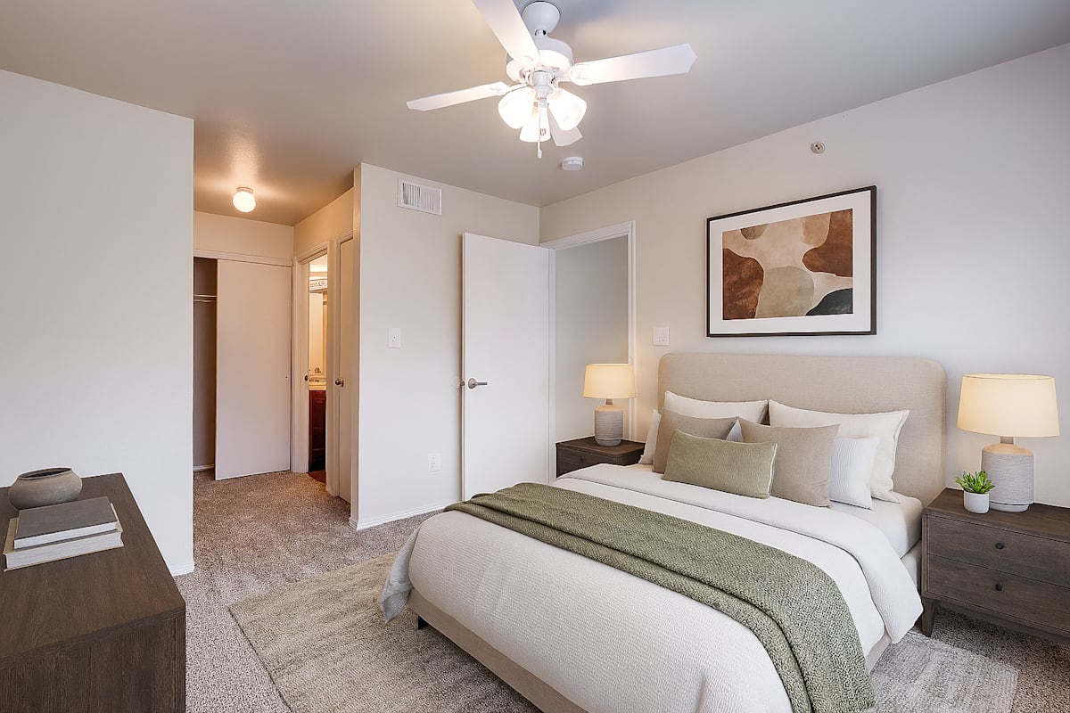 Flats at Five Mile Creek bedroom with ceiling fan - Dallas, TX