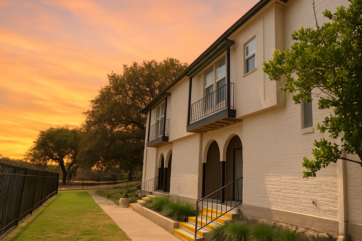 Oak Terrace exterior building with balcony and staircase - San Antonio, TX