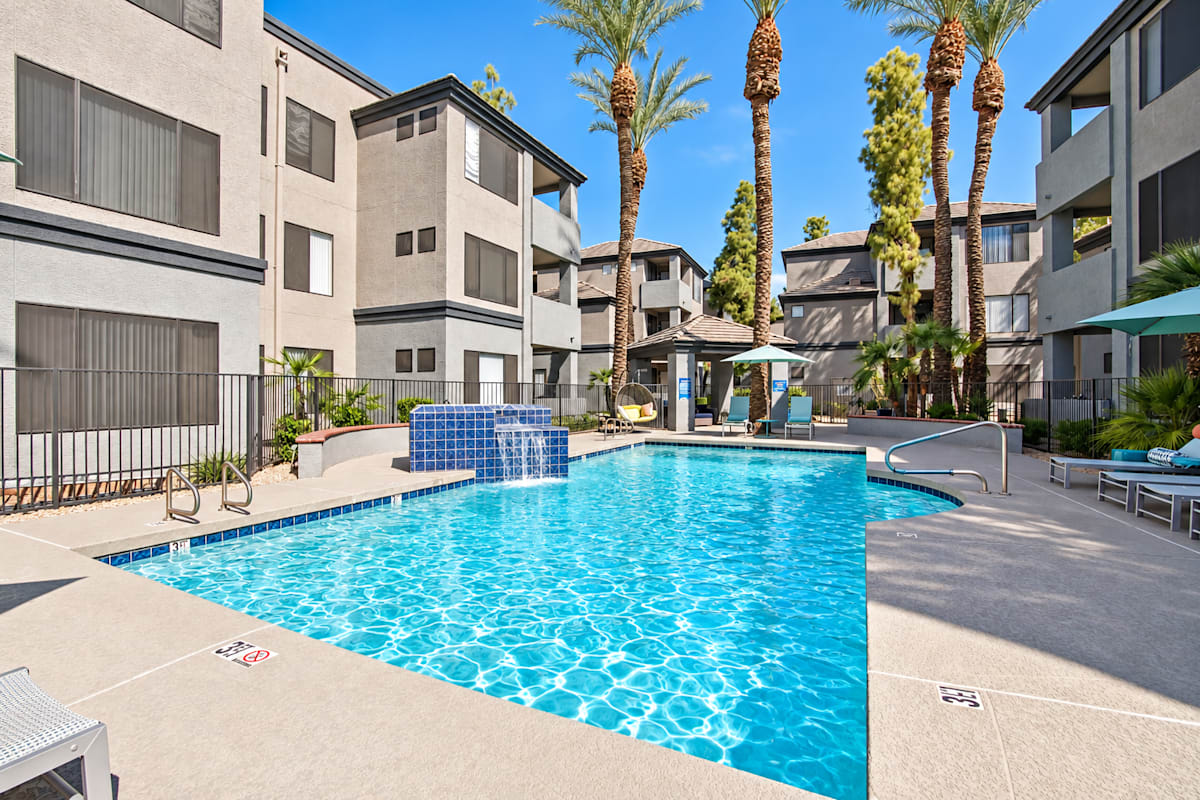Pool and poolside area at Ingleside Apartments.
