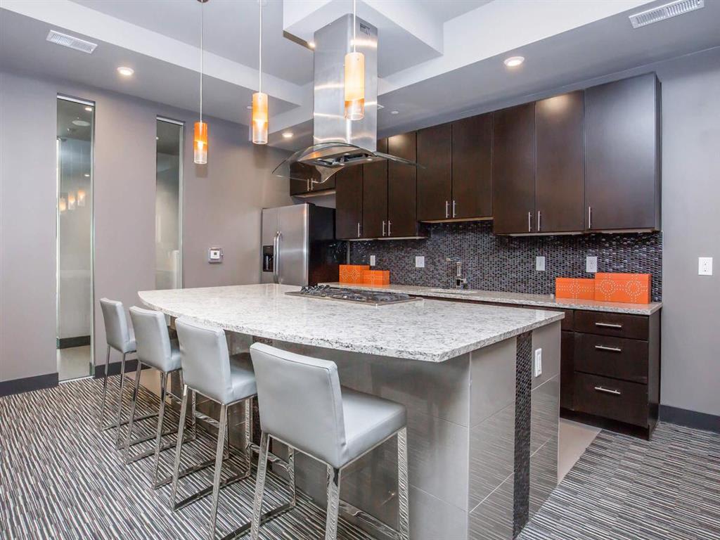 Lofts at Lincoln Station community kitchen with counter seating - Lone Tree, CO