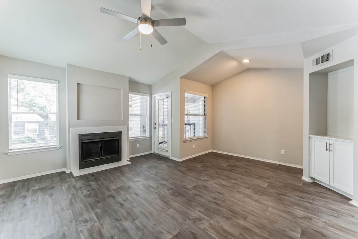 Marina Landing living room with fireplace and hardwood floors - Orlando, FL