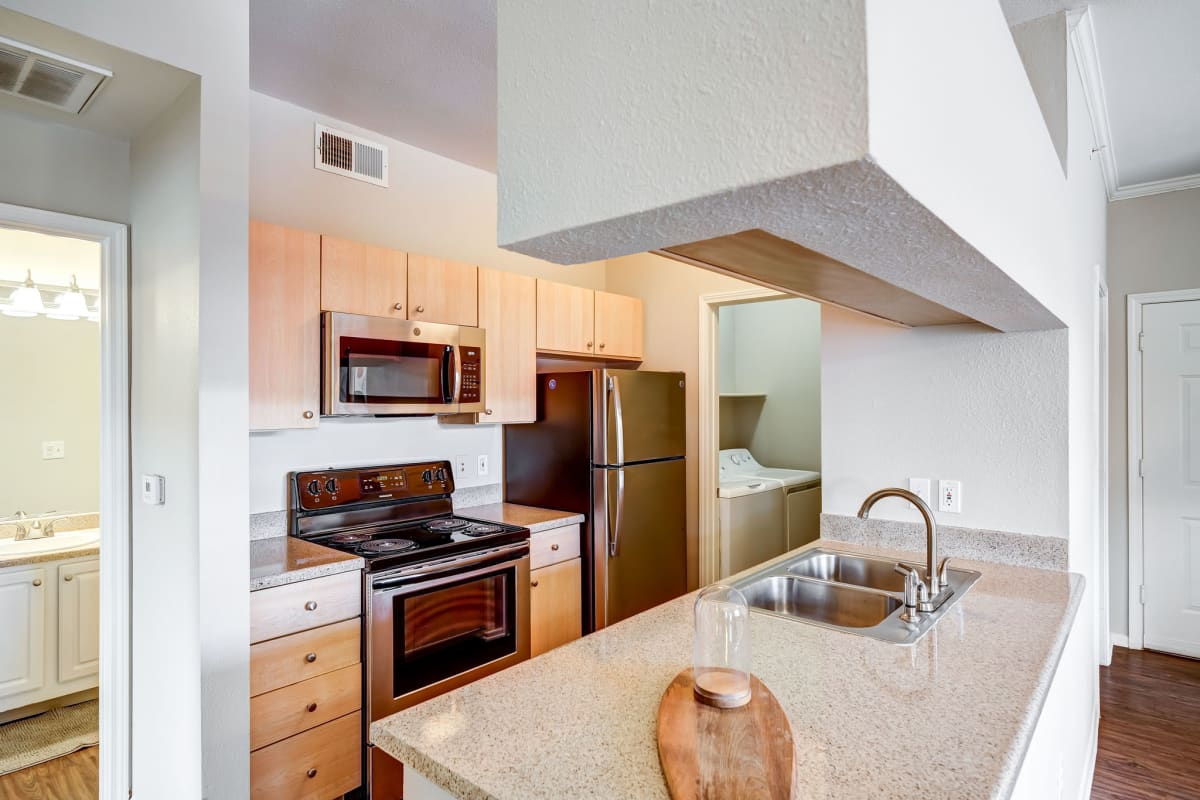 Sonoma Resort at Saddle Rock kitchen with granite-style counters - Aurora, CO