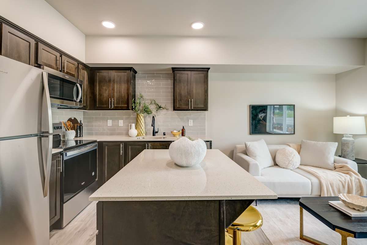 The Camden unit kitchen with refrigerator and range - Tacoma, WA