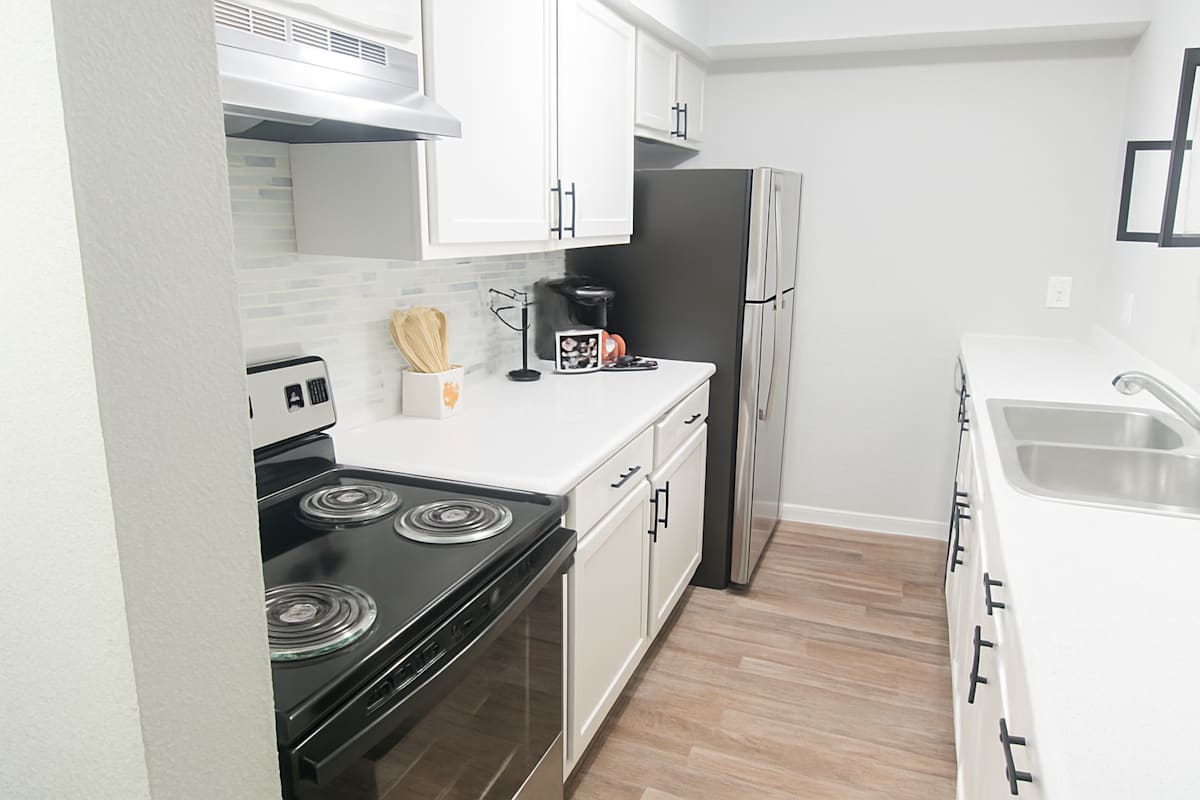 City West Apartment Homes kitchen with black appliances - Longview, TX