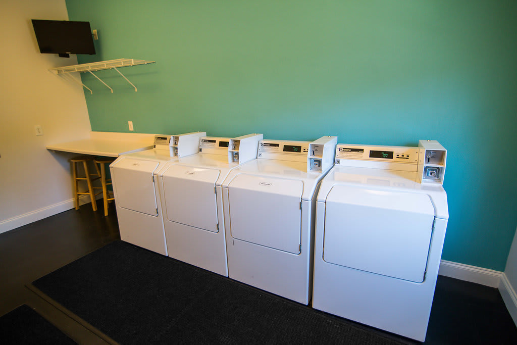 Legacy at Friendly Manor on-site laundry room with washers - Greensboro, NC