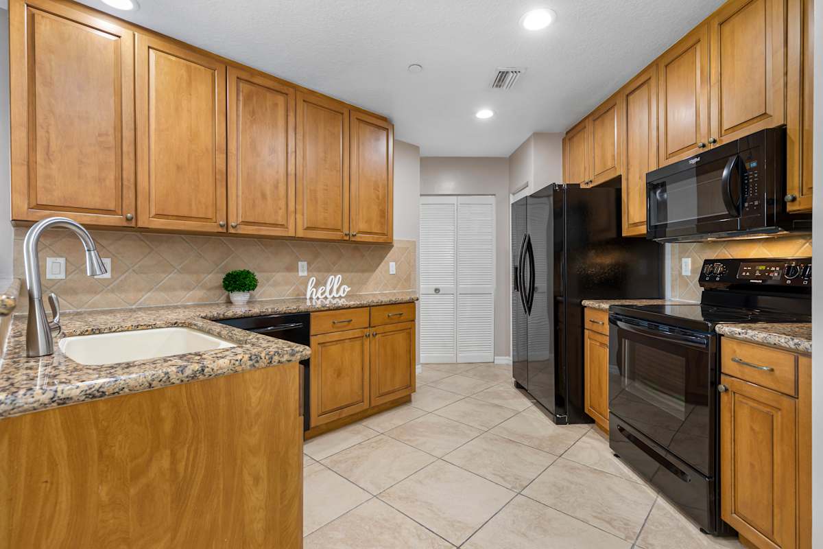Monteverde at Renaissance Park kitchen with wood cabinets - Boyton Beach, FL