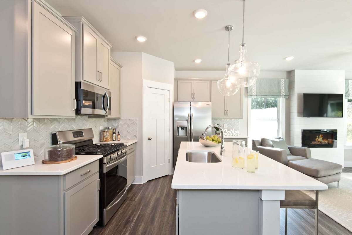 Neely Village open kitchen and living area with fireplace - Mauldin, SC