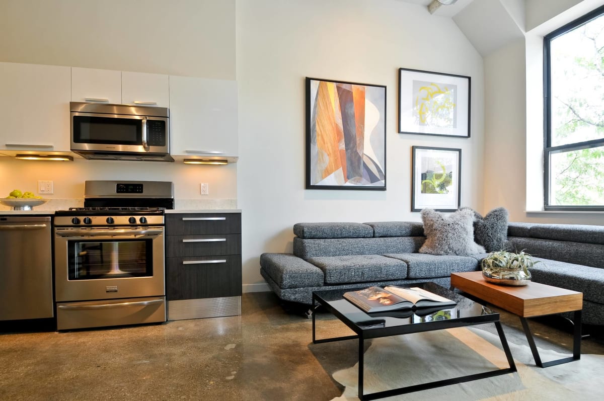 13thirteen Randolph Street Lofts living room with couch and table - Chicago, IL