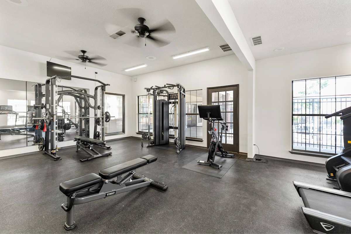 Silverwood Apartments gym with weights and machines - Mission, KS
