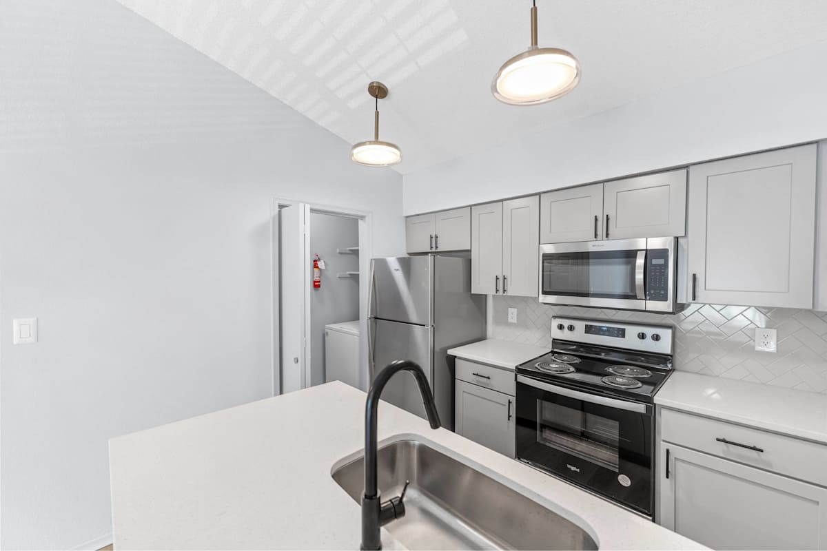Silverwood Apartments kitchen with white cabinets - Mission, KS