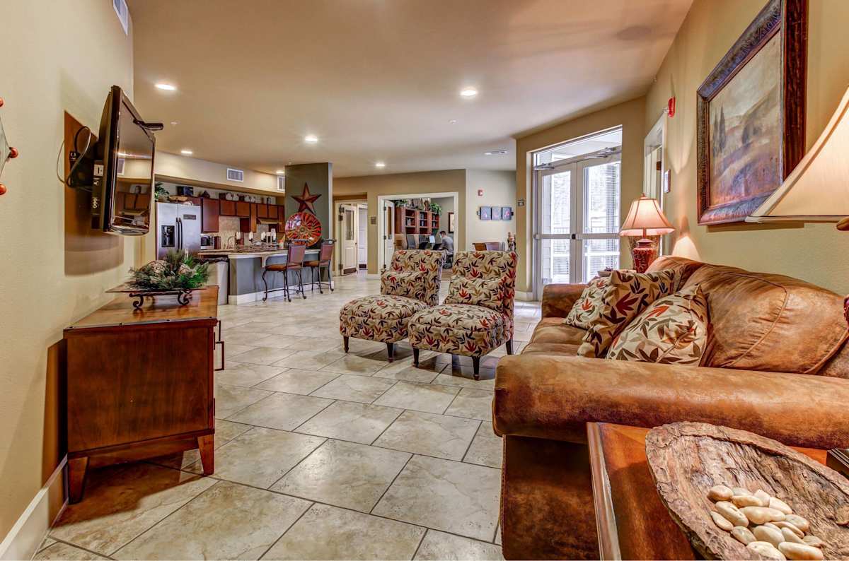 HemisView Village clubroom with couches and TV - San Antonio, TX