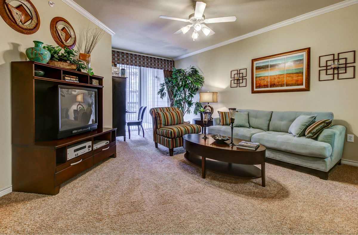 HemisView Village living room with floor-to-ceiling windows - San Antonio, TX