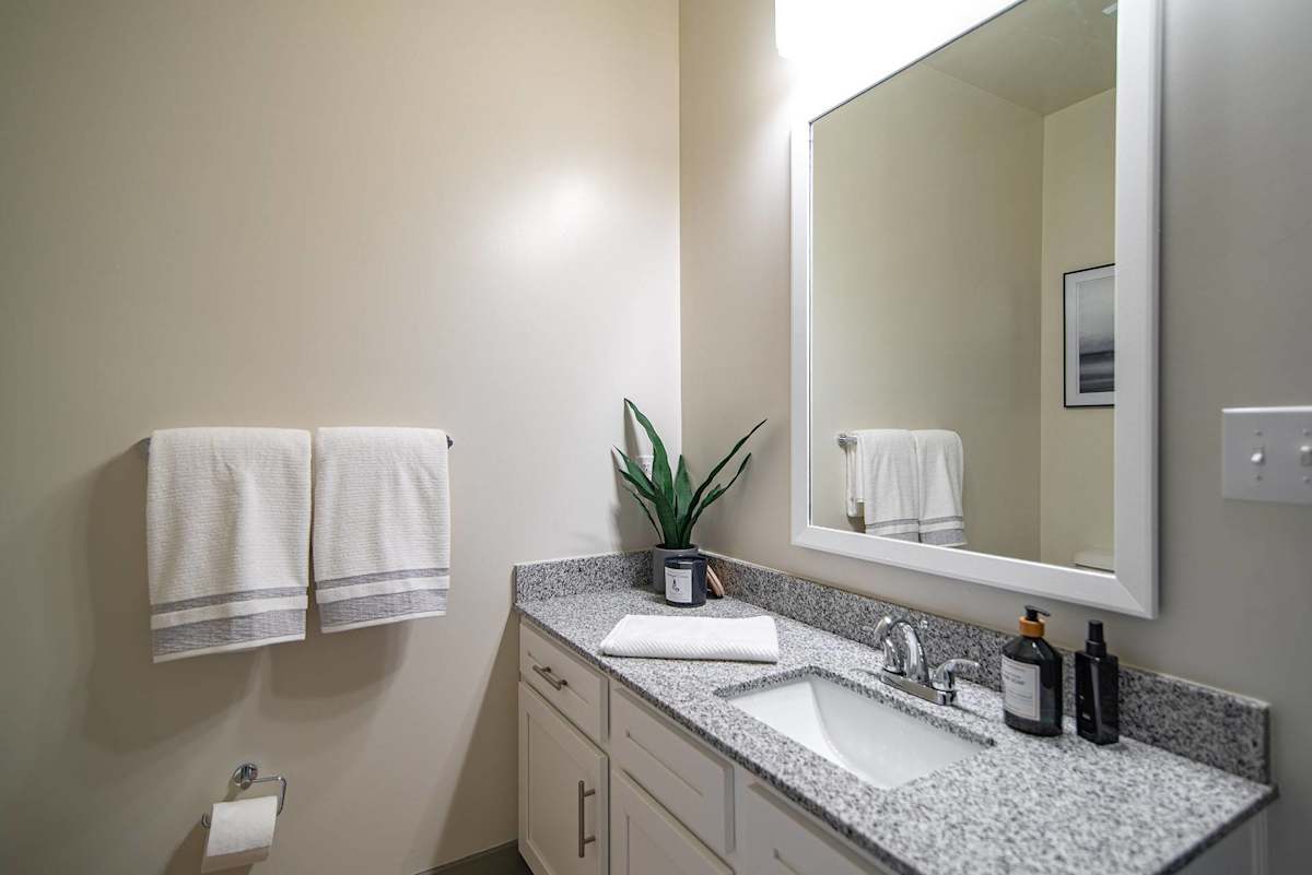 The Summit at Nashville West apartment bathroom vanity and mirror - Nashville, TN