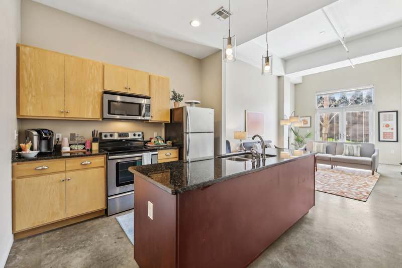The Marquee at Belle Meade Apartments kitchen with black granite and stainless appliances - Nashville, TN