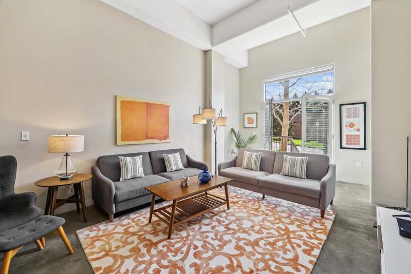 The Marquee at Belle Meade Apartments living room with sofa and artwork - Nashville, TN