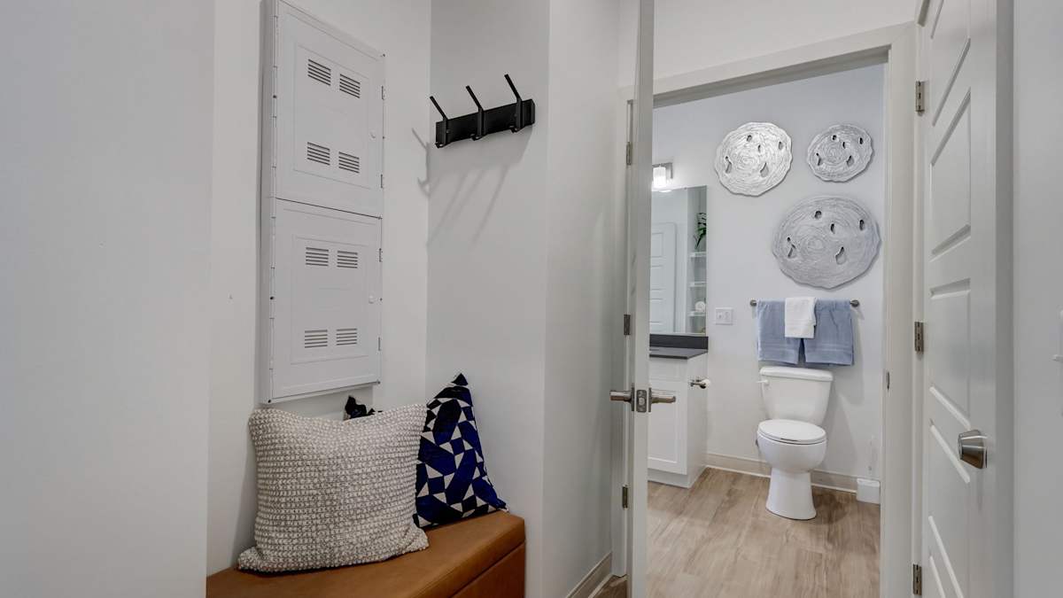 The Artisan at Robinson apartment entryway with storage near bathroom - Pittsburgh, PA