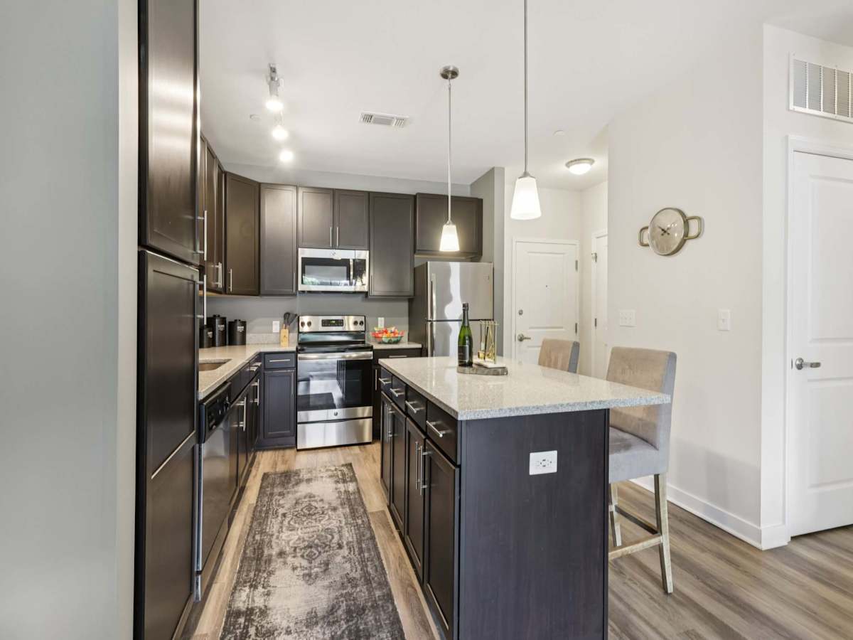 The Ashby at South Hills Village Station kitchen with stainless appliances - Upper St Clair, PA