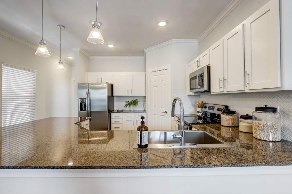 Courts of Bent Tree kitchen with granite counters and cabinets - Dallas, TX