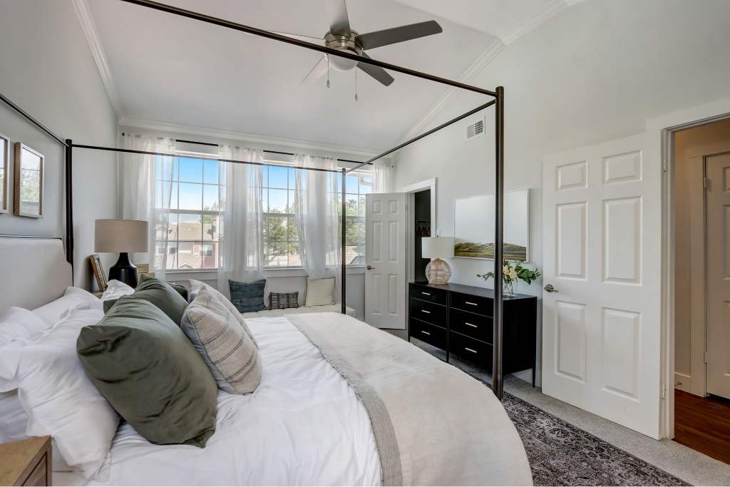 Courts of Bent Tree bedroom with four-poster bed and ceiling fan - Dallas, TX