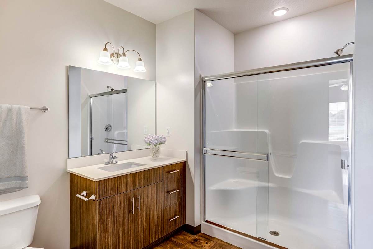 Fairway Flats & The Heights at Fairway Flats bathroom with glass shower - Lawrence, KS