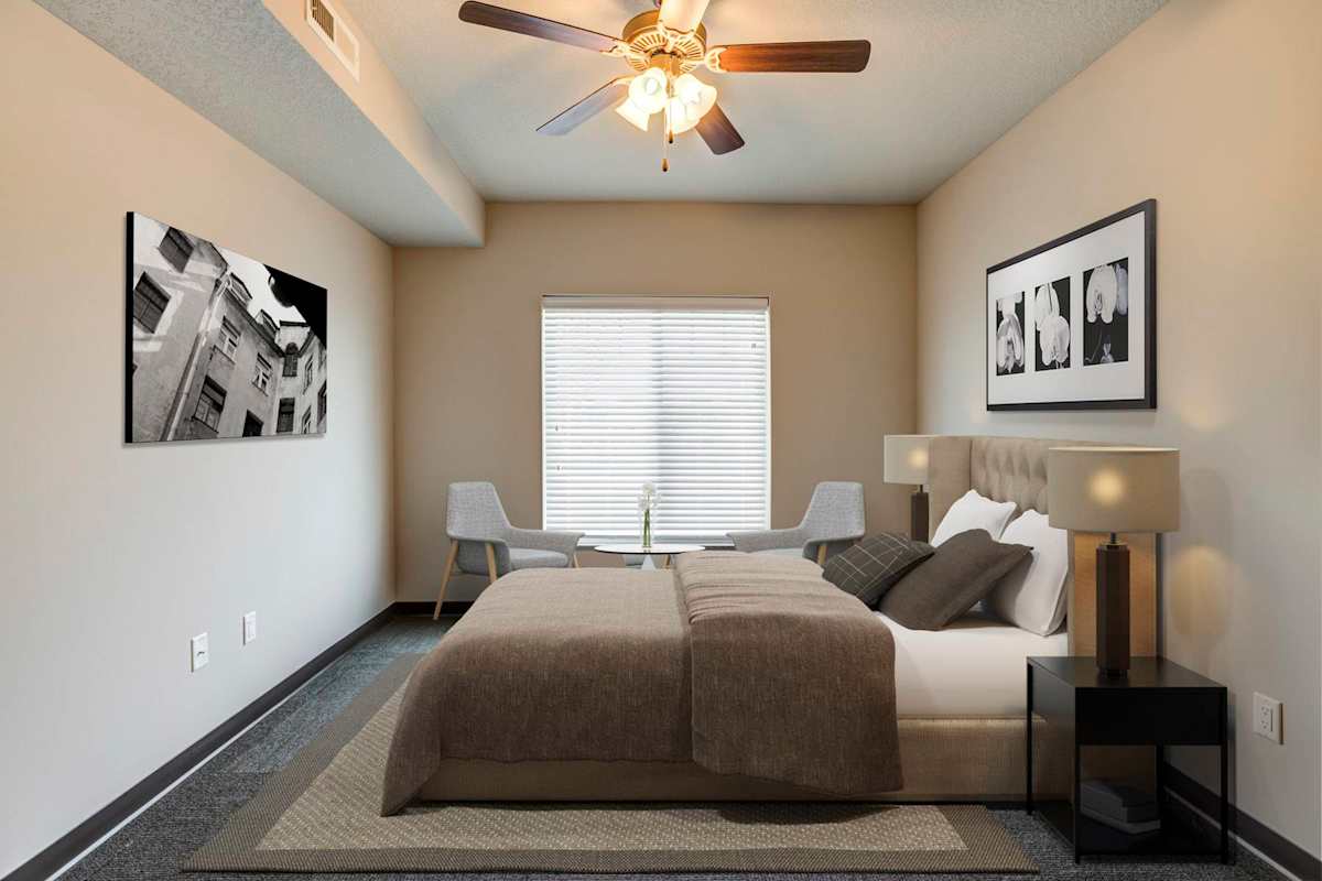 Fairway Flats & The Heights at Fairway Flats bedroom with ceiling fan - Lawrence, KS