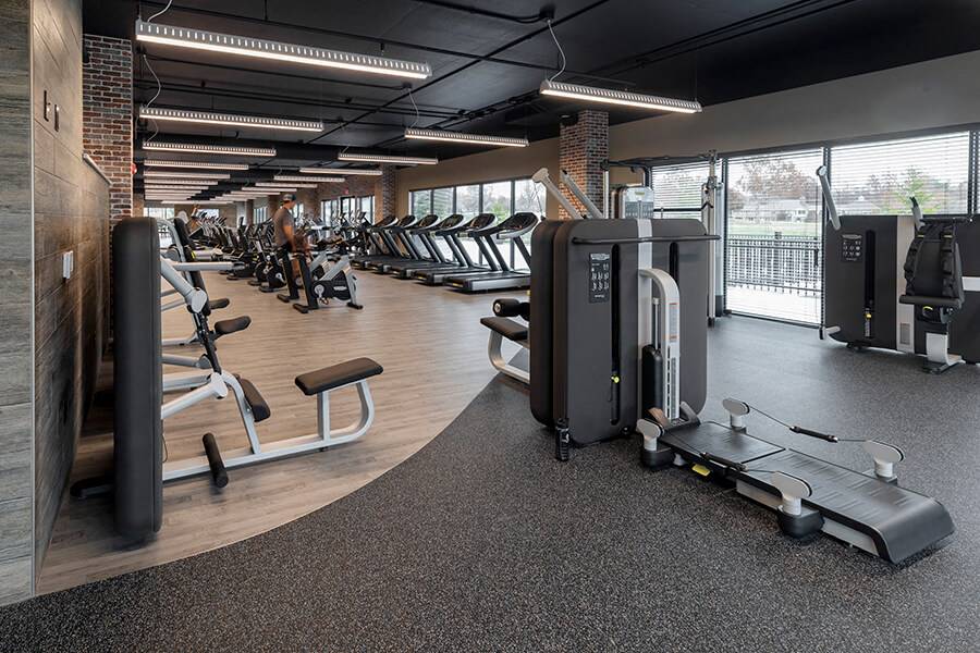 Fairway Flats & The Heights at Fairway Flats fitness center with cardio equipment - Lawrence, KS
