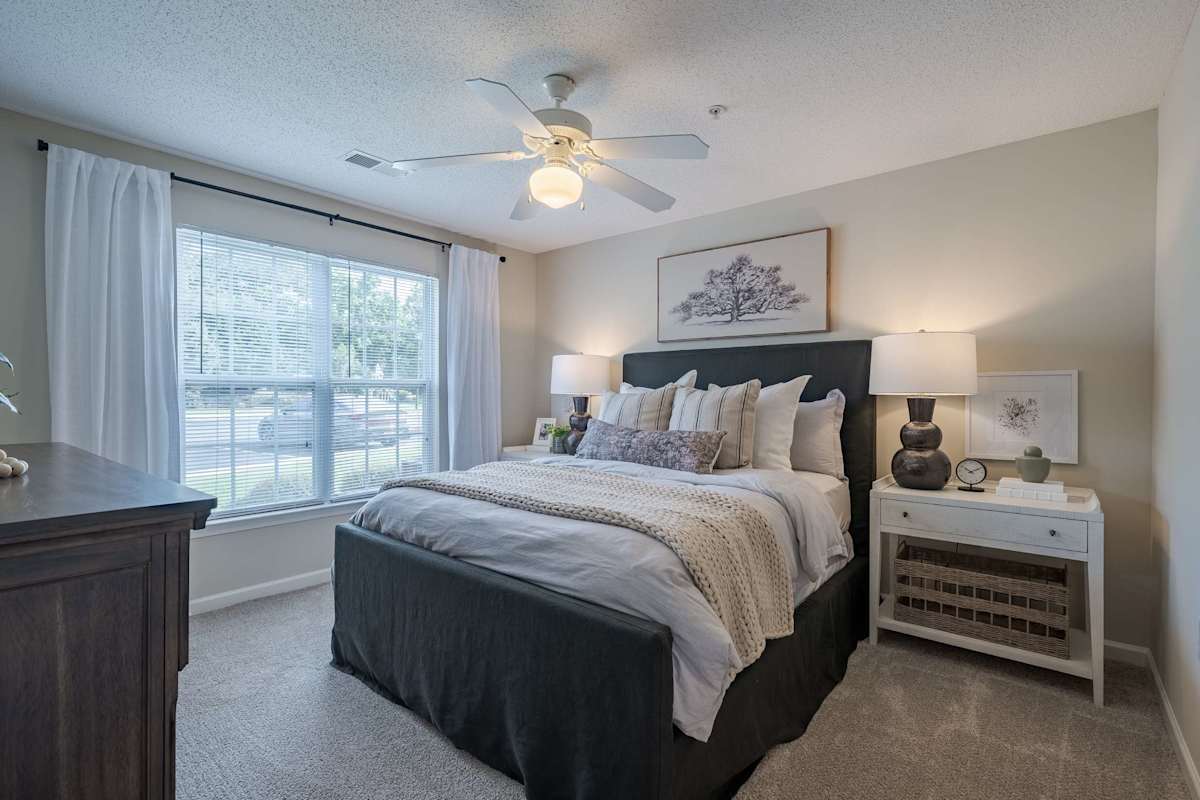 Legacy at Berkeley Place apartment bedroom with ceiling fan - Goldsboro, NC