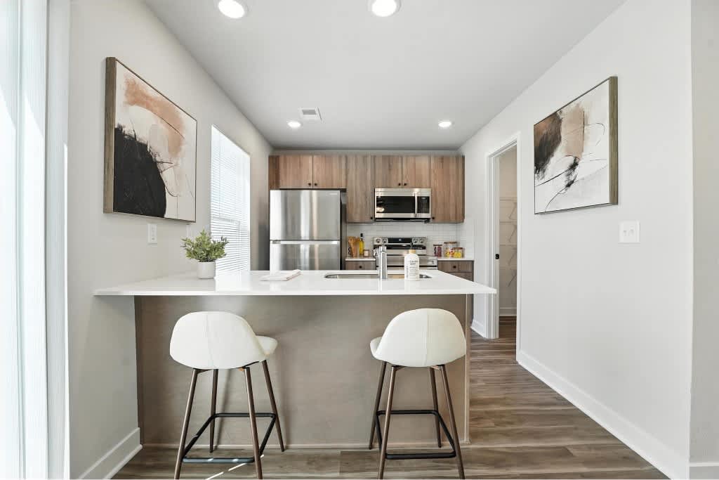 Rustic Heights Townhomes kitchen with island seating - Oak Grove, MO