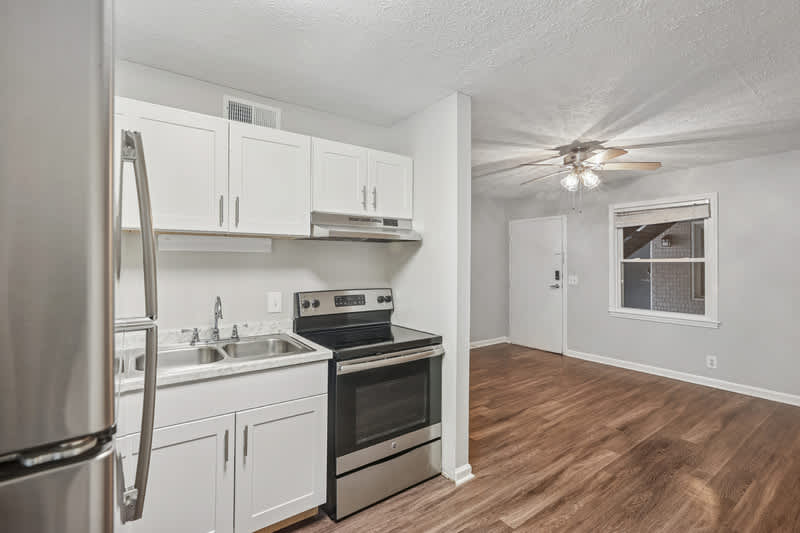 1808 Edgehill Apartments unit kitchen with white cabinets - Nashville, TN