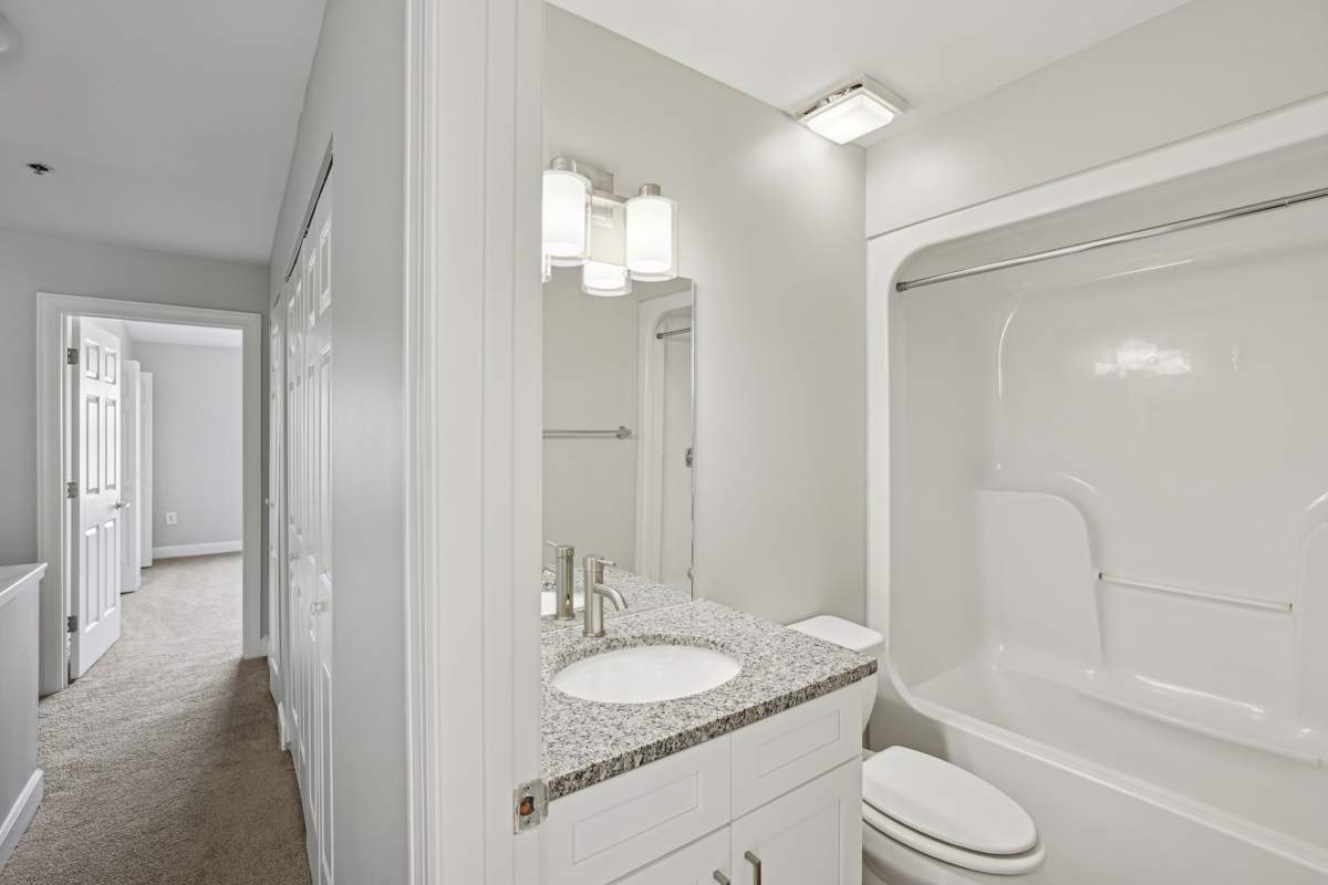 Wesley Place Apartments bathroom with tub and vanity - Nashville, TN