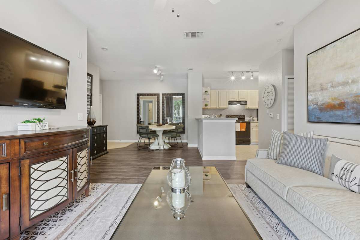 The Sanctuary at Highland Oaks living room with sofa - Tampa, FL