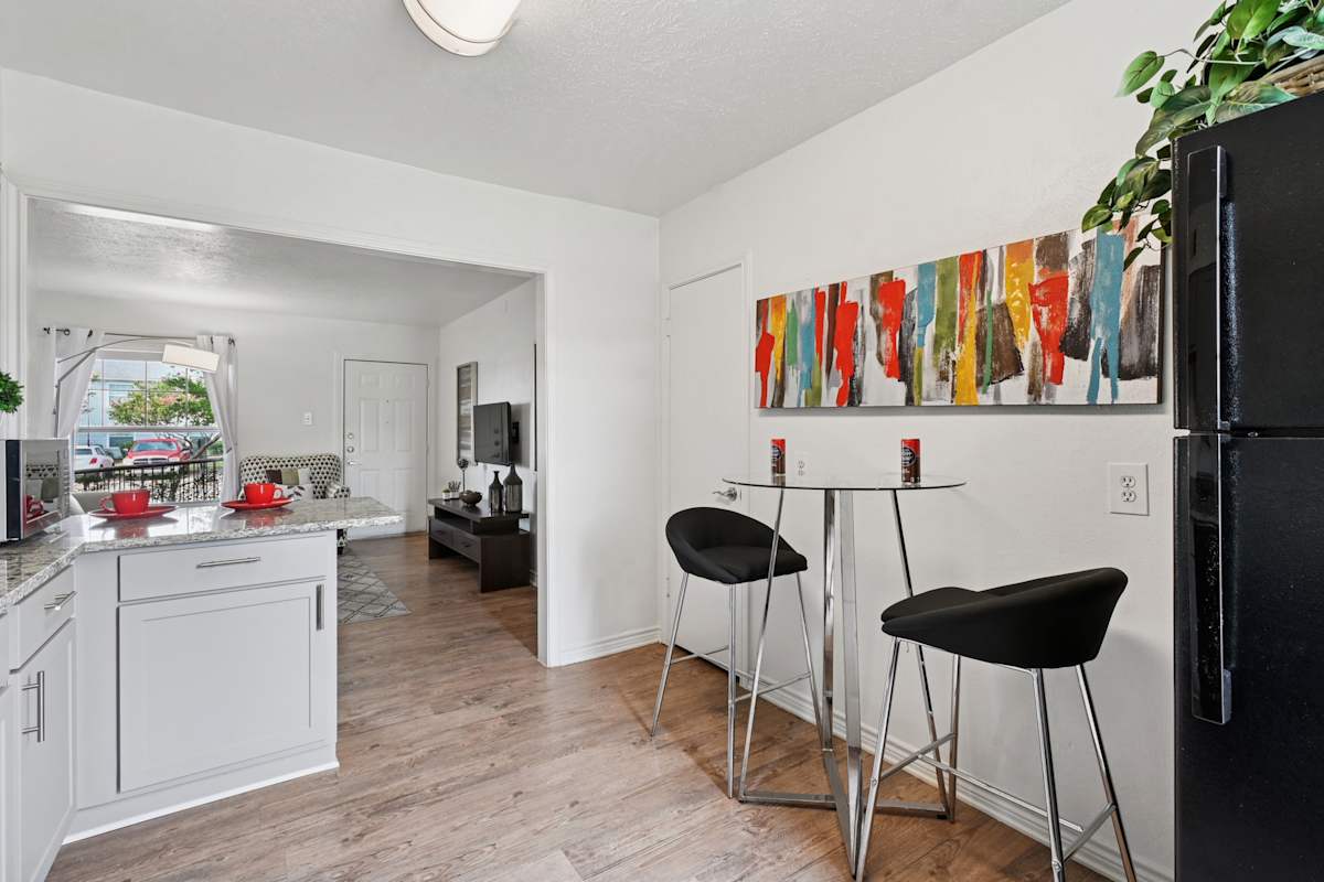 Hillburn Hills kitchen with bar seating and refrigerator - Dallas, TX