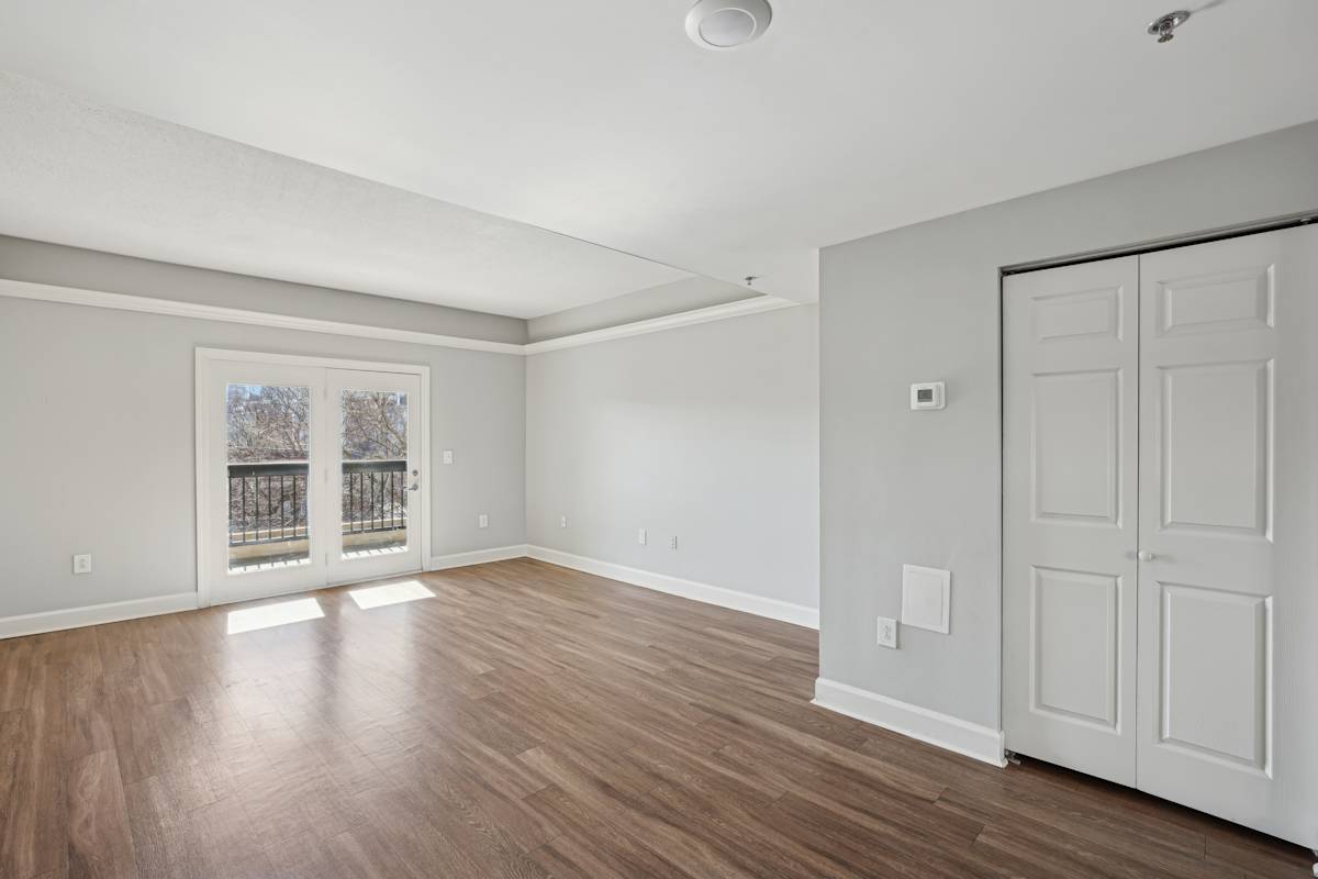 Wesley Place Apartments room with wood floors and door entry - Nashville, TN