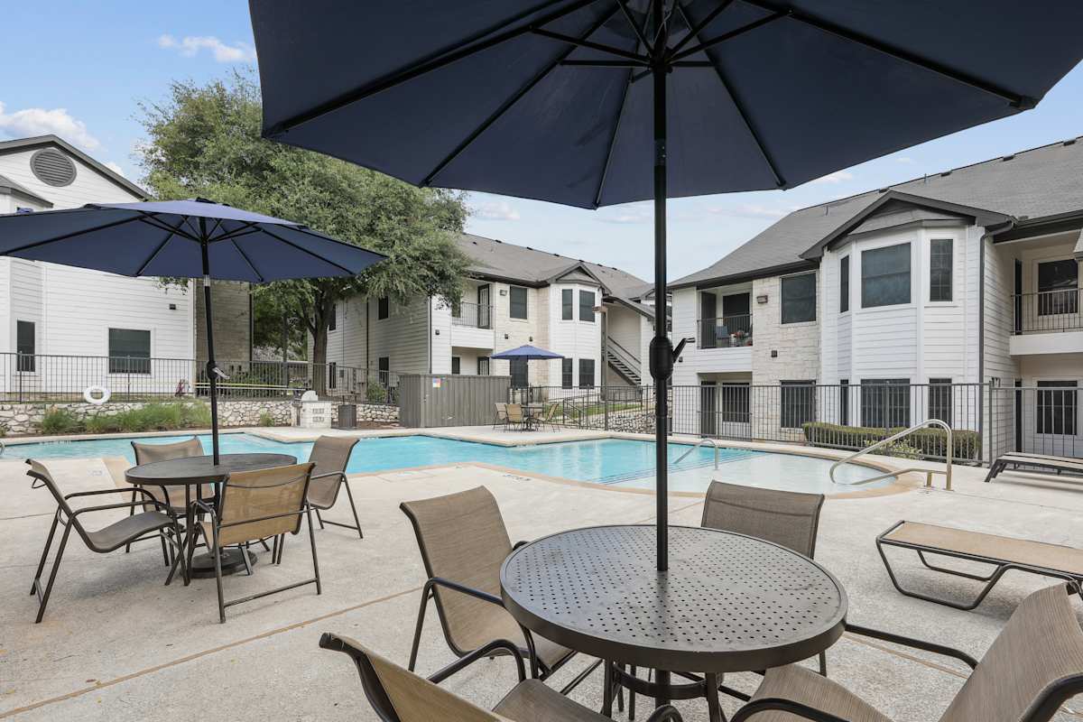 SoCo Apartments pool with outdoor tables - Austin, TX