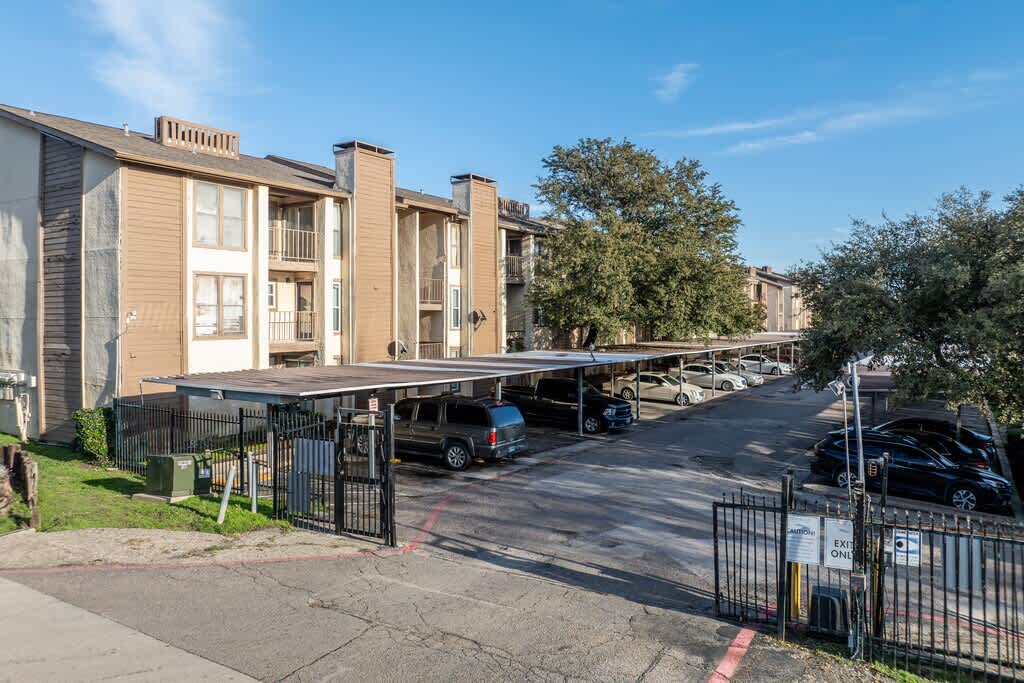 Tealwood Apartment Homes parking area exterior - Dallas, TX