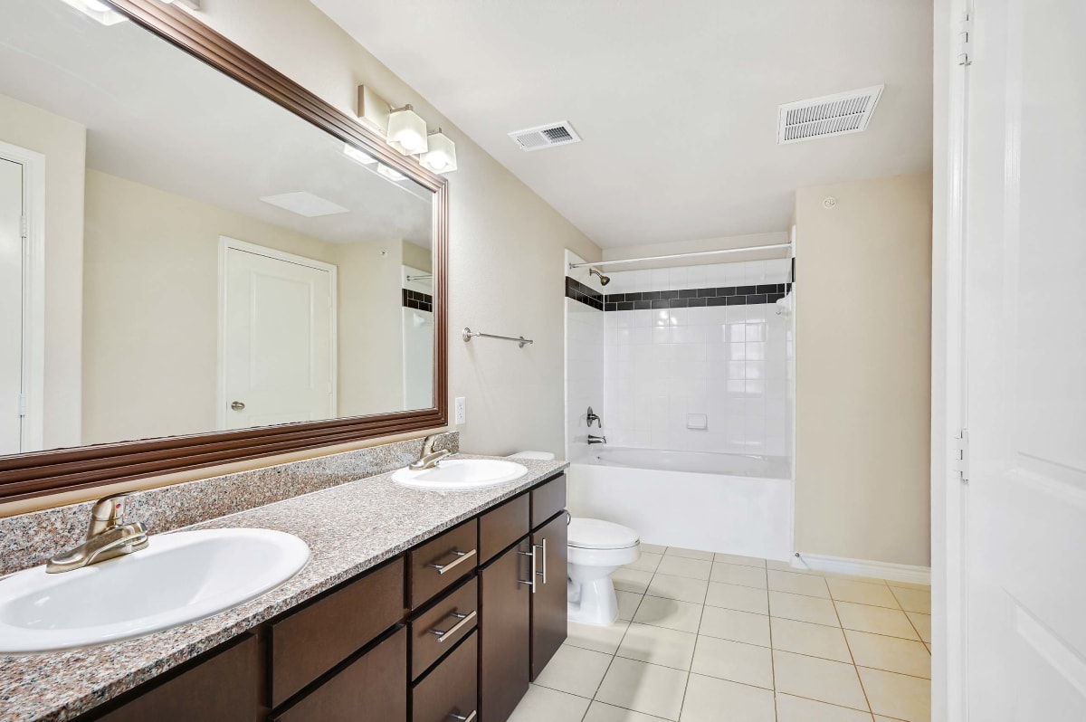 Greenhaven Apartments bathroom with double sinks - McKinney, TX