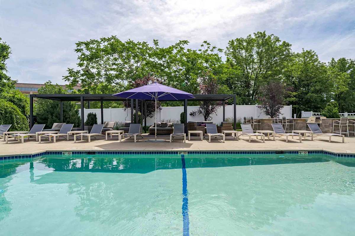 Wellington Place pool seating and umbrellas - Medford, MA