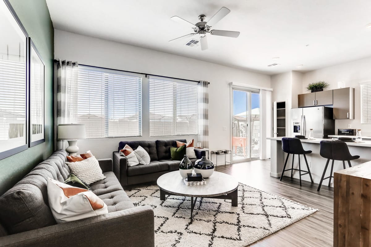 Furnished apartment living area shown — representative home at Avilla Camelback Ranch.