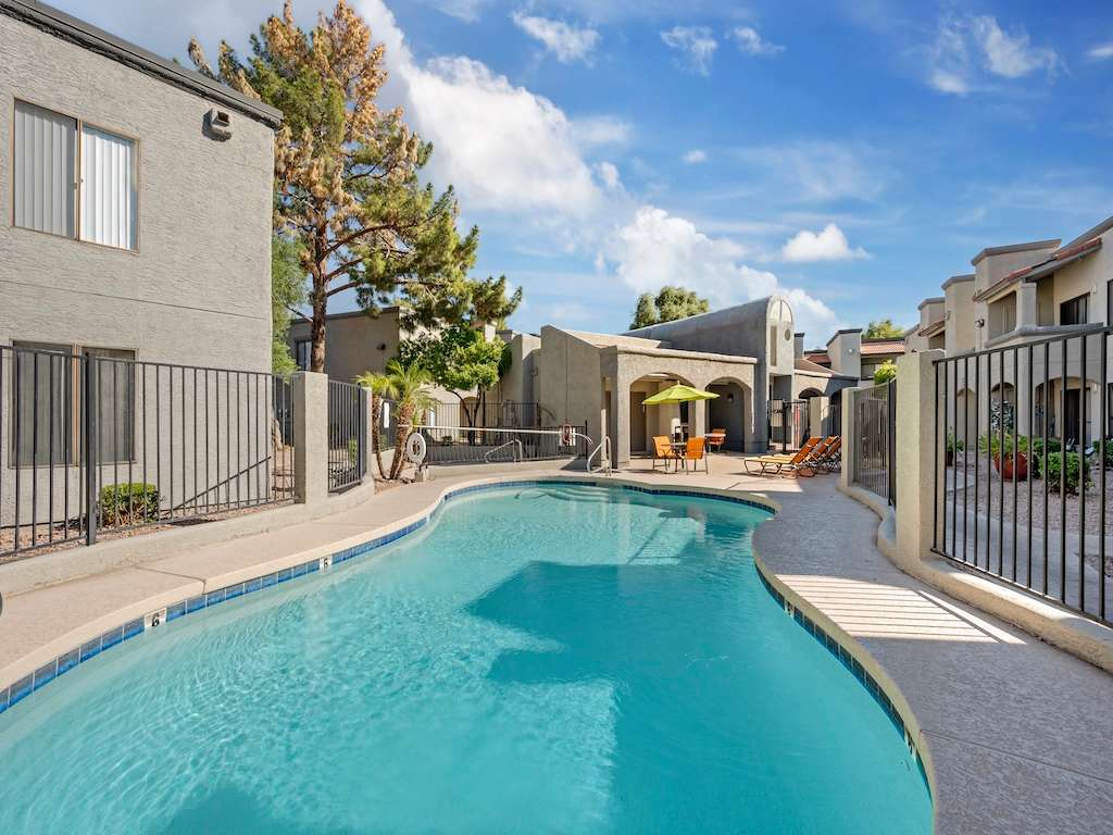 Swimming pool within the apartment courtyard — view 1 at Glen Oaks Apartments.