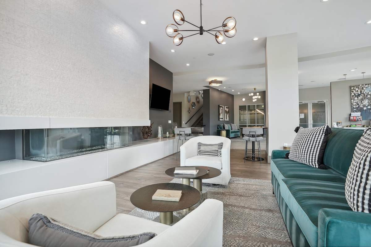 Westend lounge with fireplace and white sofa - Denver, CO