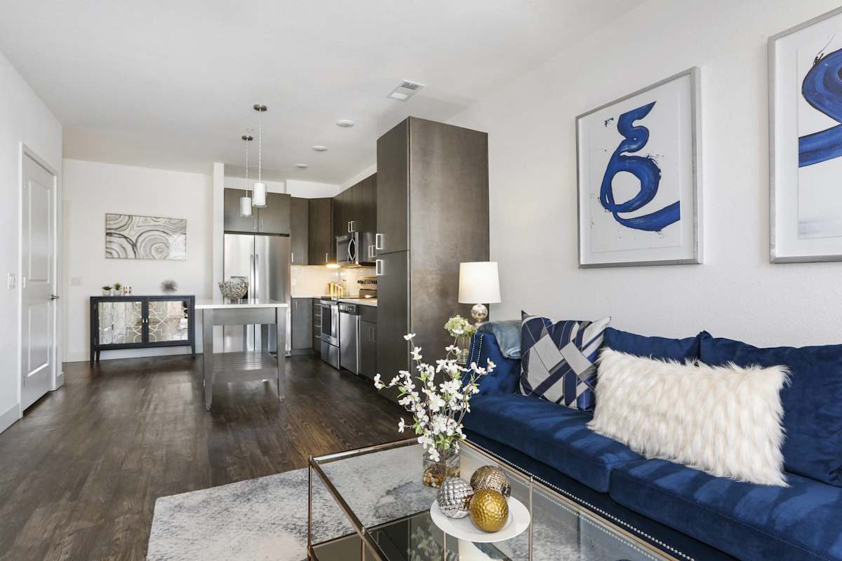 The Lydian living room with blue sofa - Denver, CO