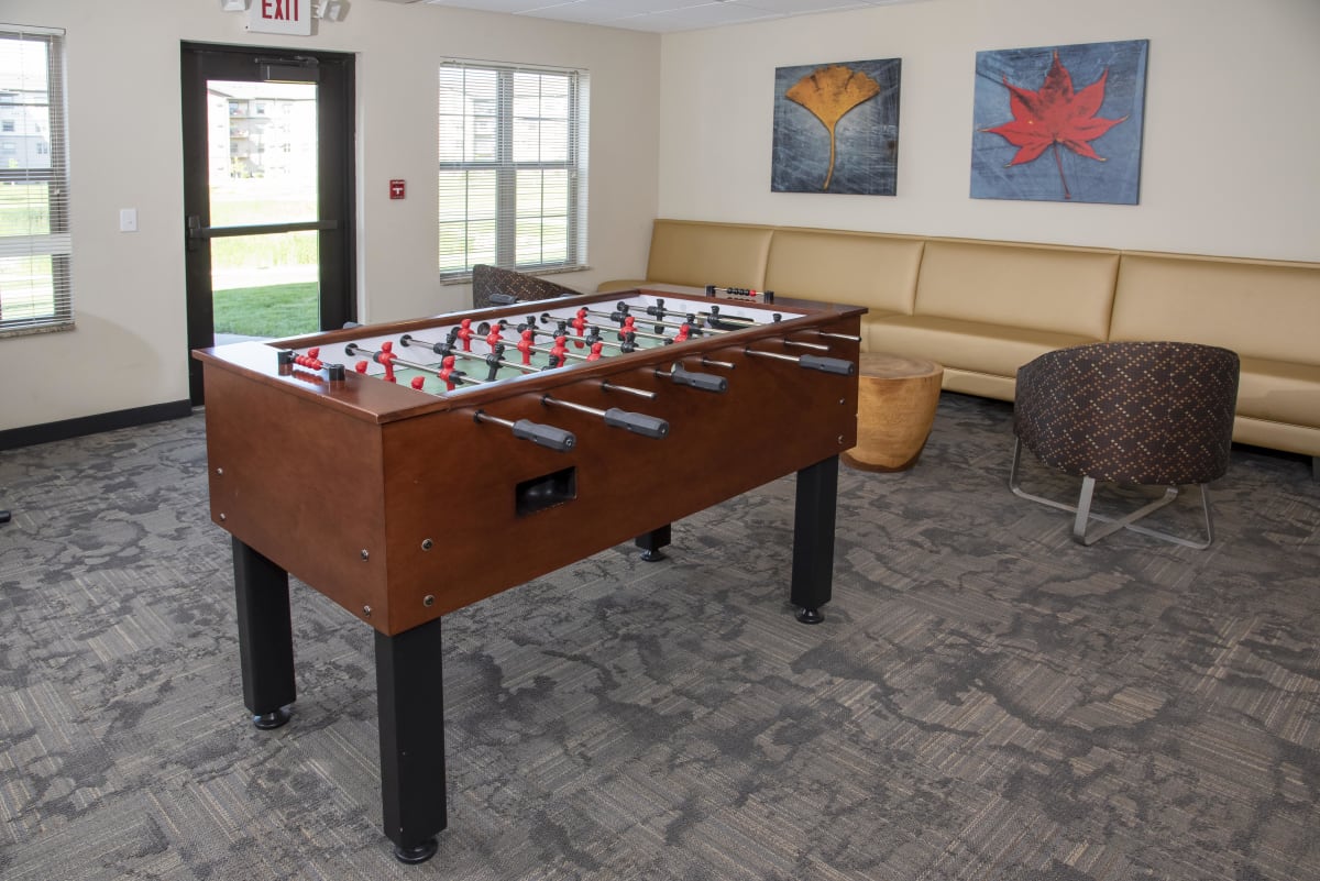 Cardinal Point Apartments game room with foosball table - Grand Forks, ND